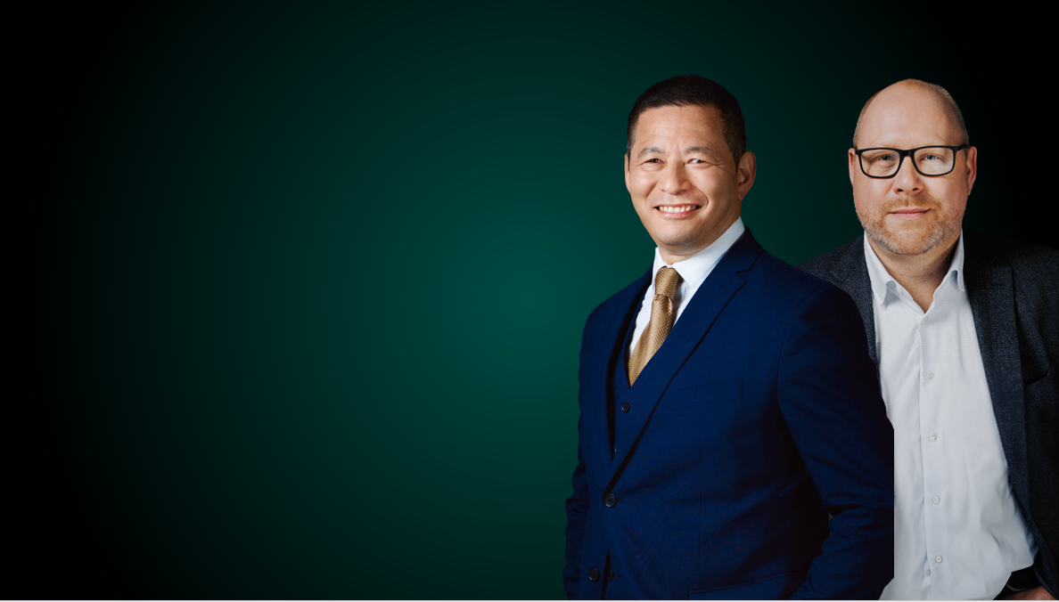 Man dressed in a blue suit, smiling